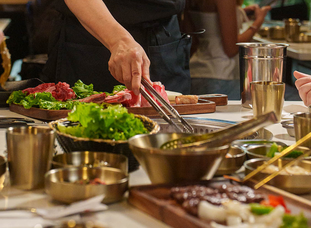 Tabletop grill with premium meats at Koho